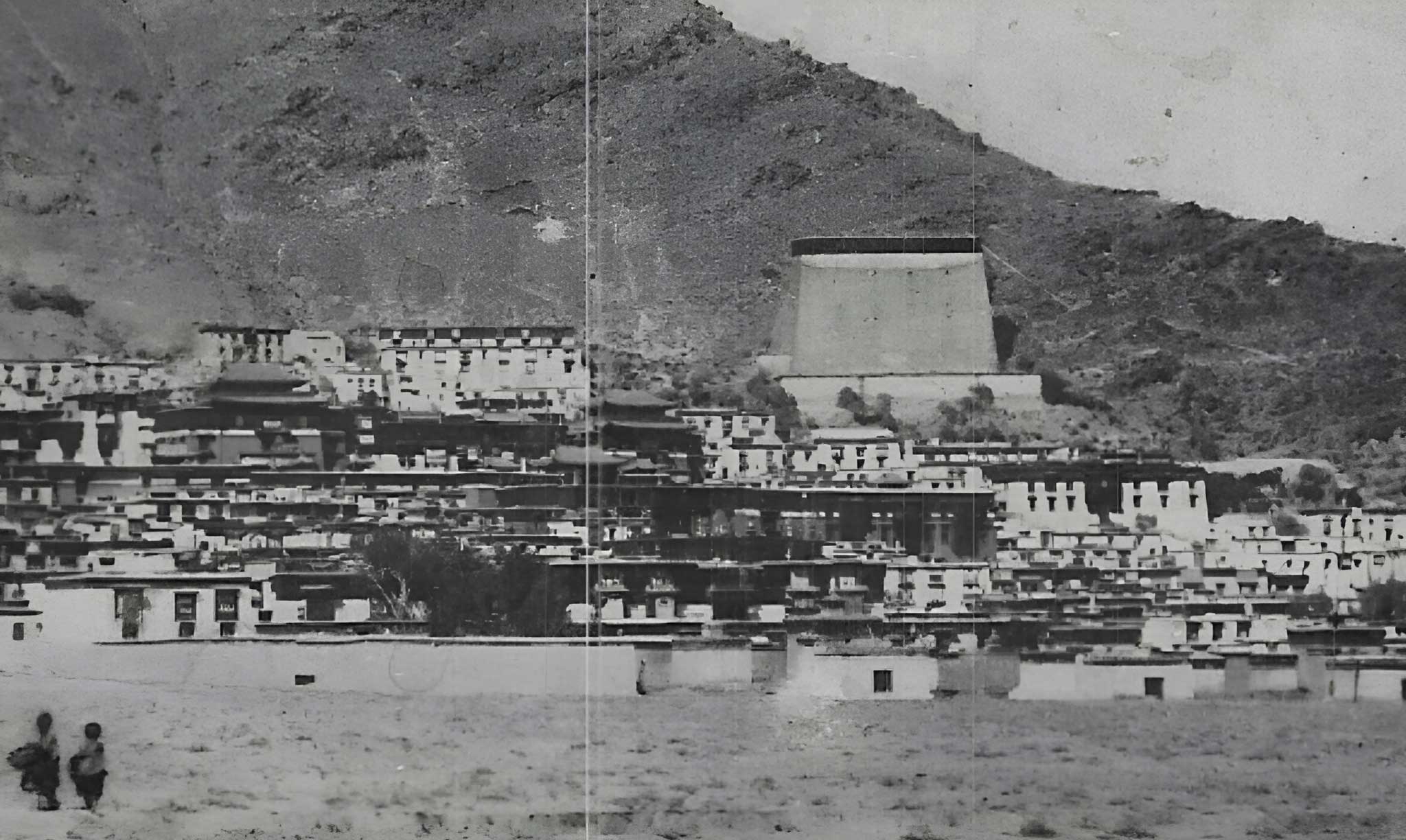 Black and white wide shot of the original monastery.