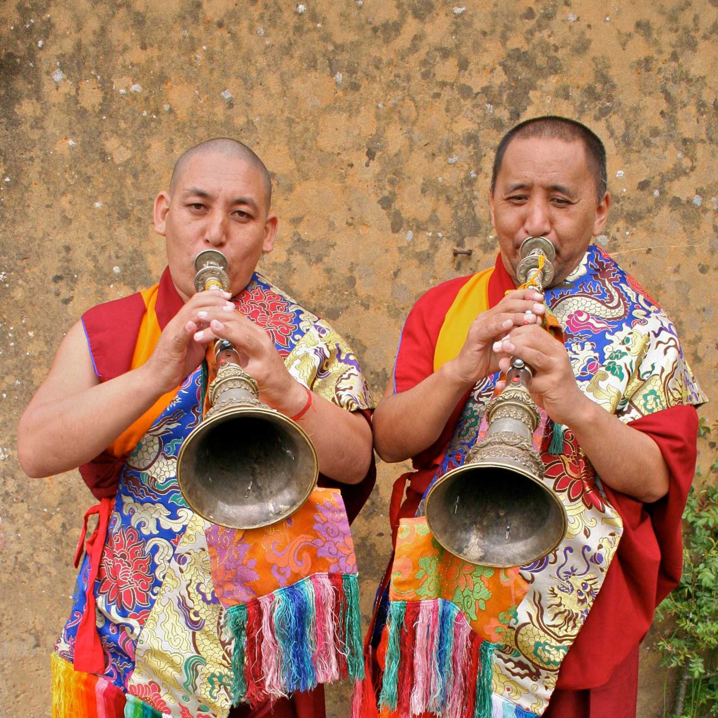 Two monks playing long horns (gyaling).